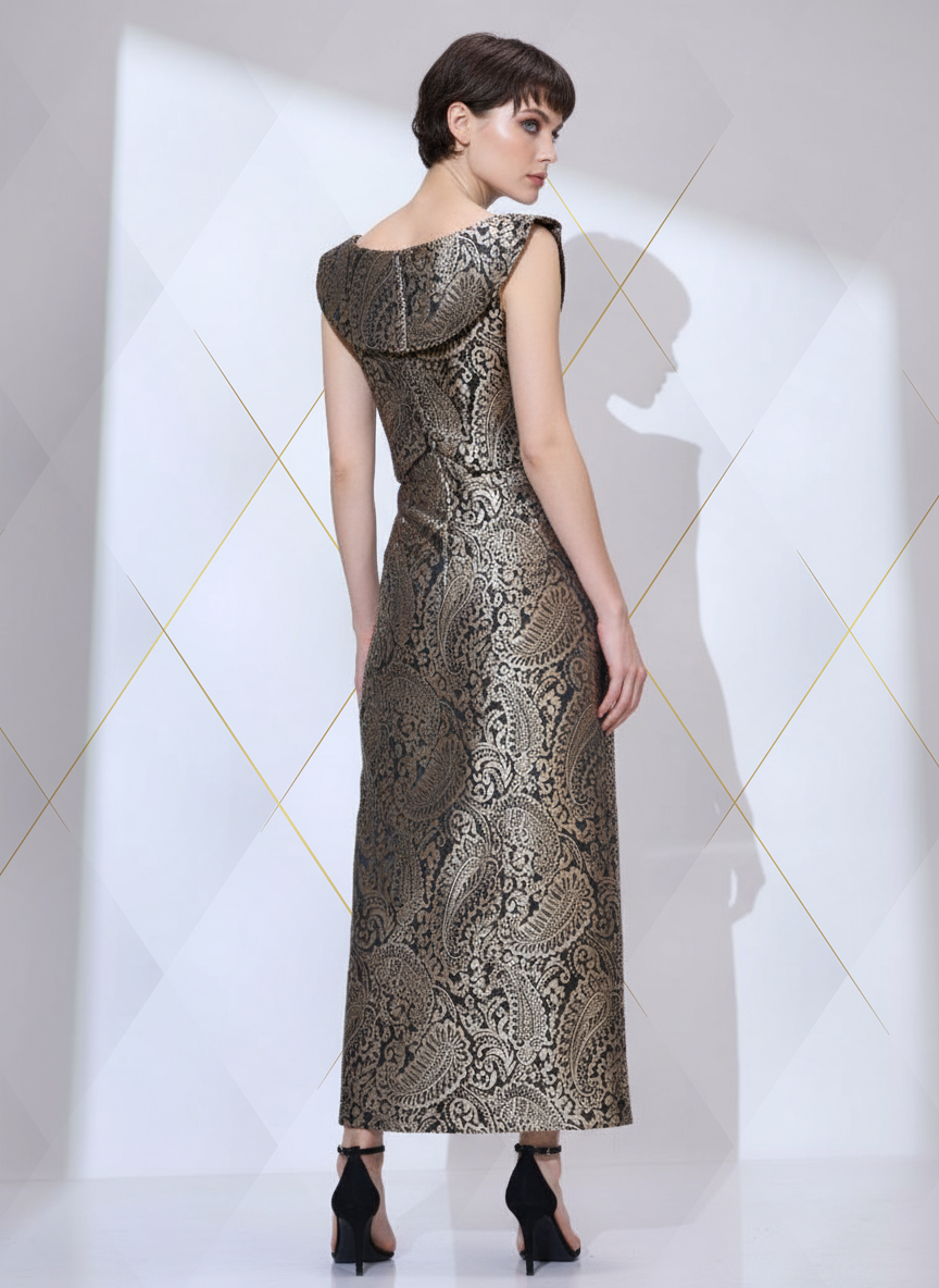 Image of Back view of woman looking right wearing a black and gold metallic paisley formal co-ord set for women with cropped top and maxi skirt
