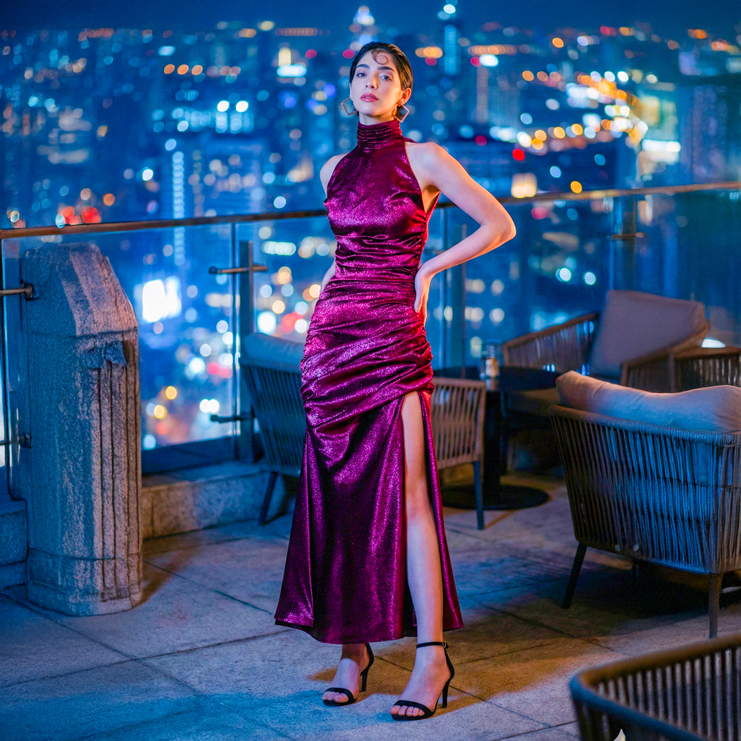 Image of Burgundy silk satin halter neck maxi dress with an elegant cowl neckline and ruched hip detail.