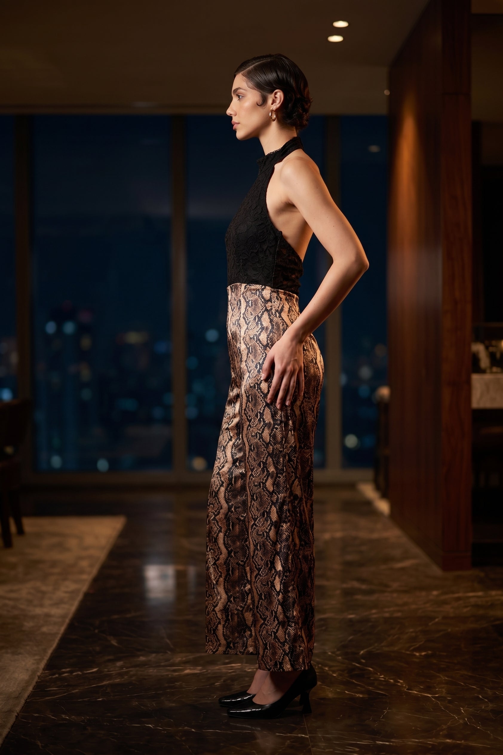 Viper black and gold metallic snakeskin wide-leg halter jumpsuit, editorial look — INHAUTECOUTURE